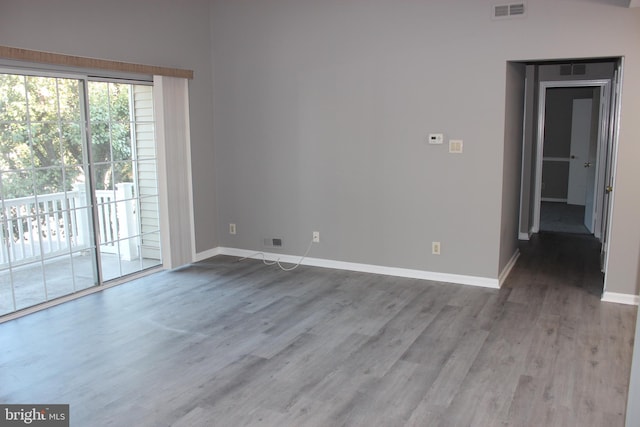 spare room with hardwood / wood-style flooring