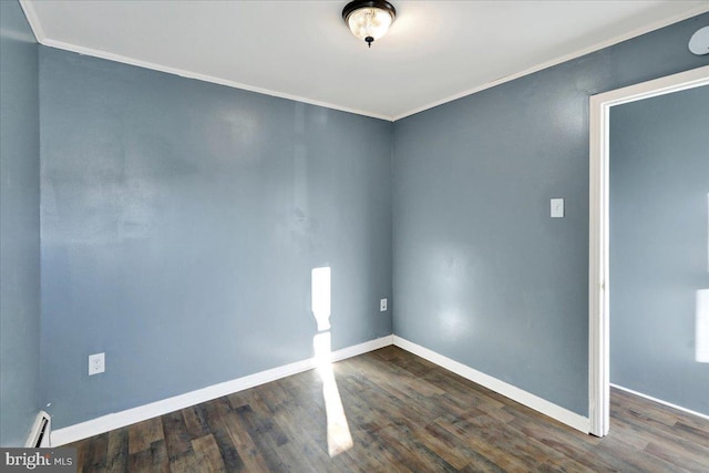 spare room with crown molding, dark hardwood / wood-style floors, and a baseboard heating unit