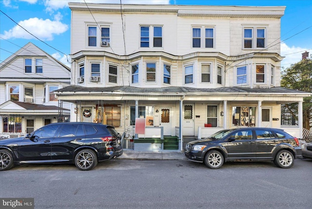 townhome / multi-family property featuring a porch