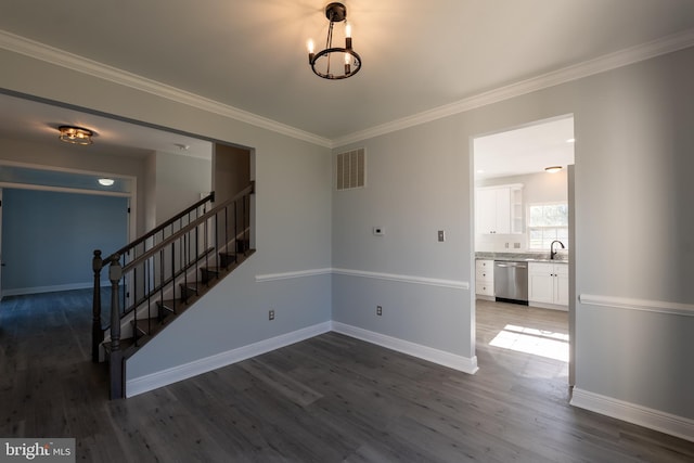 interior space with sink, crown molding, and dark hardwood / wood-style flooring