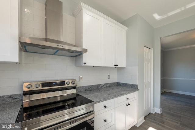 kitchen featuring white cabinets, wall chimney range hood, stainless steel range with electric cooktop, and dark hardwood / wood-style flooring