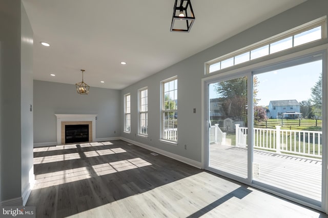 unfurnished living room featuring dark hardwood / wood-style floors