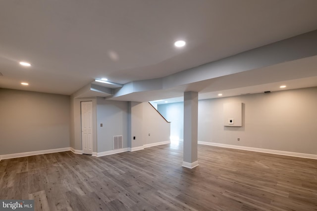 basement featuring hardwood / wood-style flooring