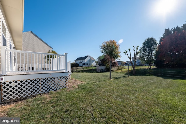 view of yard with a wooden deck