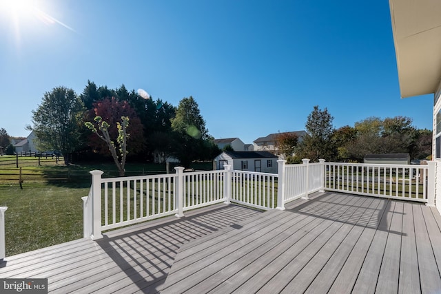 deck featuring a lawn