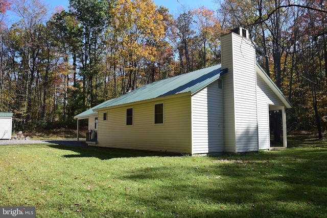 view of home's exterior featuring a yard