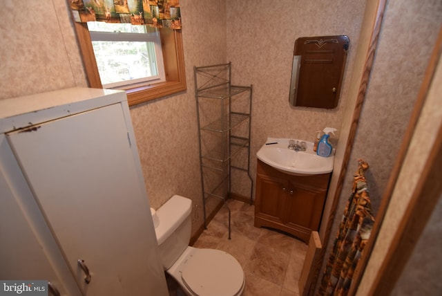 bathroom with vanity and toilet