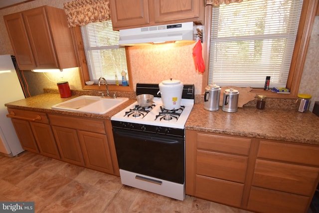 kitchen with sink and white appliances