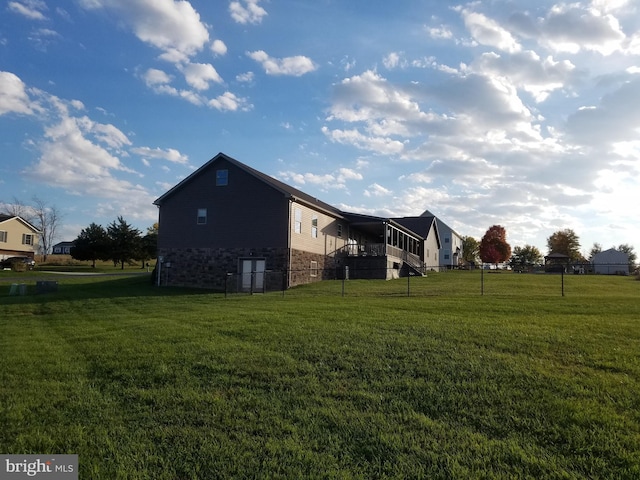 view of home's exterior featuring a lawn