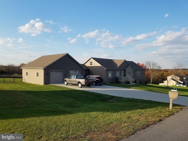 view of front of house featuring a front yard and a garage