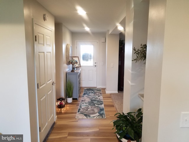 corridor featuring light hardwood / wood-style flooring