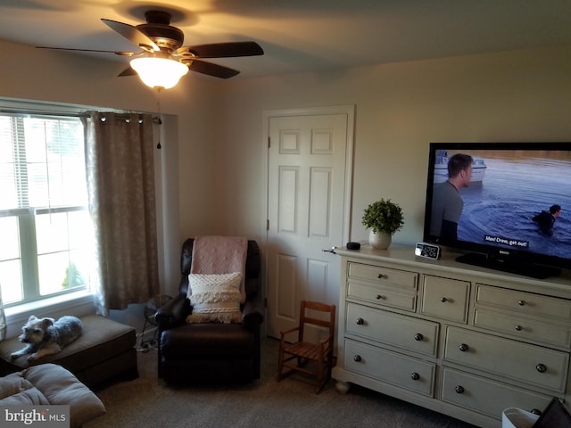 sitting room with carpet, ceiling fan, and a wealth of natural light