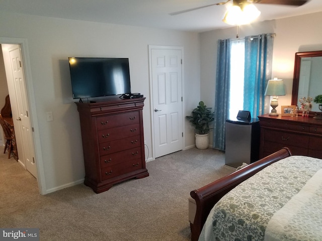 bedroom with ceiling fan and light colored carpet