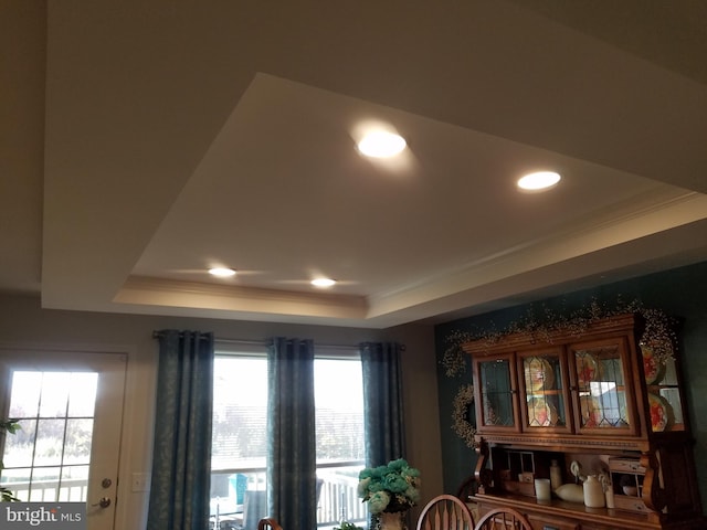 room details with ornamental molding and a tray ceiling