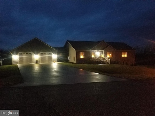 ranch-style home featuring cooling unit and a garage