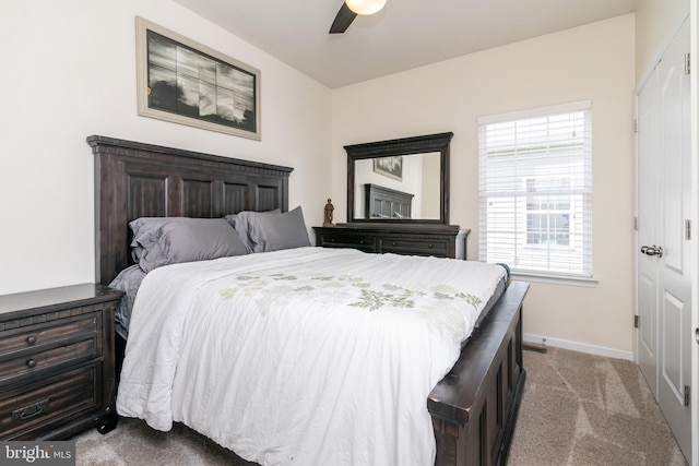 carpeted bedroom featuring ceiling fan