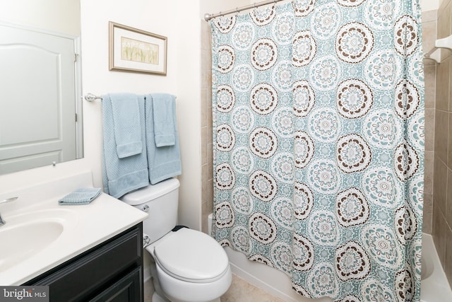 full bathroom with vanity, shower / bath combo, and toilet