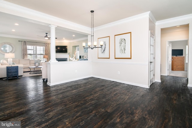 unfurnished dining area featuring crown molding, dark hardwood / wood-style floors, and ceiling fan