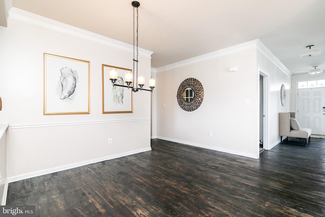 unfurnished dining area with ornamental molding and dark hardwood / wood-style flooring