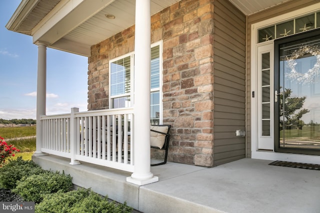 entrance to property featuring a porch