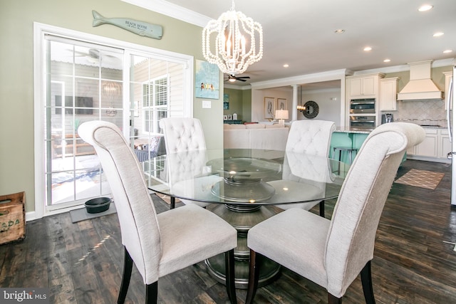 dining area with dark hardwood / wood-style flooring, ornamental molding, and plenty of natural light