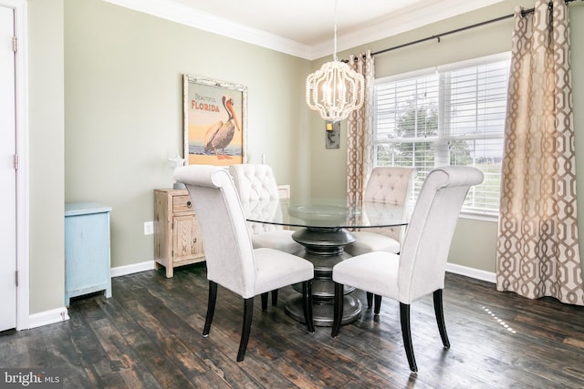 dining area with ornamental molding, an inviting chandelier, and dark hardwood / wood-style floors