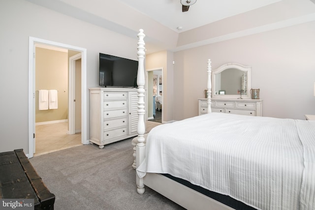 carpeted bedroom featuring ensuite bathroom and ceiling fan