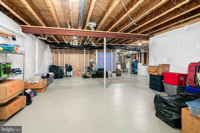 basement with washer / dryer and water heater