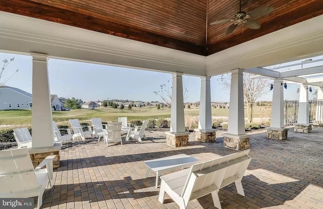 view of patio featuring ceiling fan