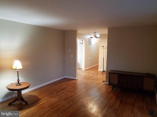 unfurnished room with hardwood / wood-style flooring