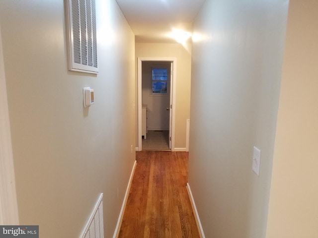 corridor featuring hardwood / wood-style flooring