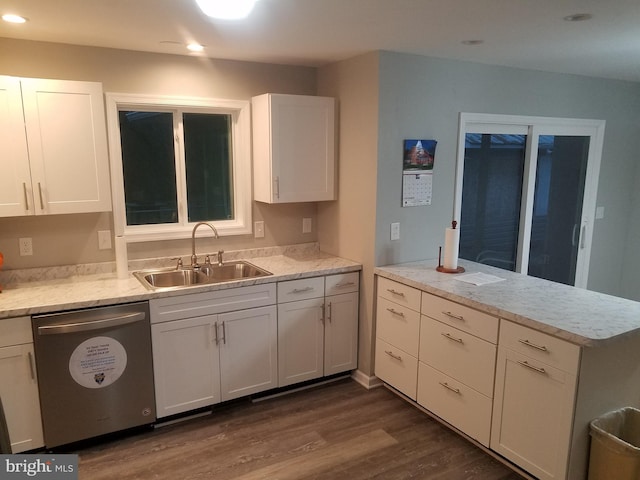 kitchen with dishwasher, white cabinets, sink, dark hardwood / wood-style floors, and light stone counters