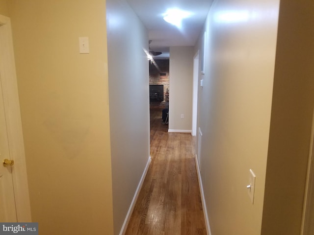 corridor with wood-type flooring