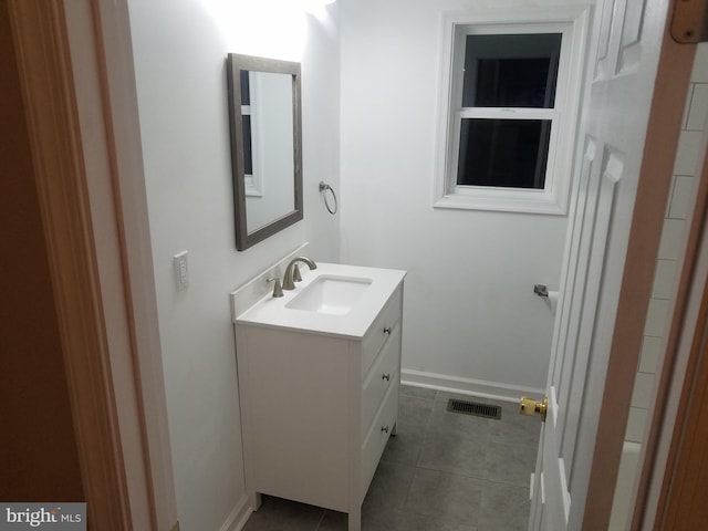 bathroom featuring tile patterned floors and vanity