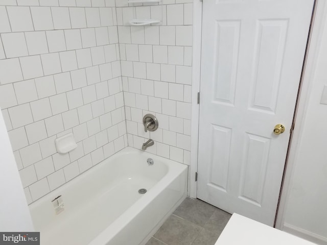 bathroom featuring tile patterned flooring and tiled shower / bath combo