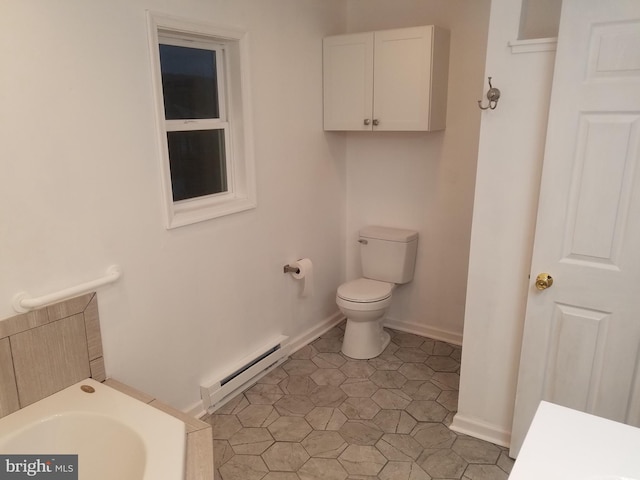 bathroom featuring tile patterned flooring, toilet, and baseboard heating