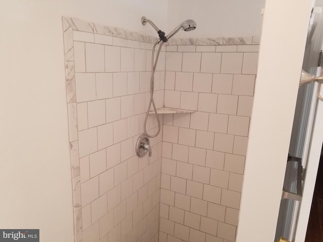 bathroom with tiled shower