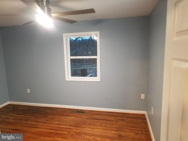 spare room featuring ceiling fan and hardwood / wood-style floors