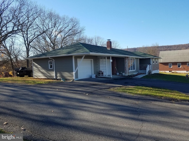 single story home featuring a garage