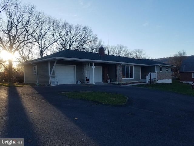 single story home featuring a garage