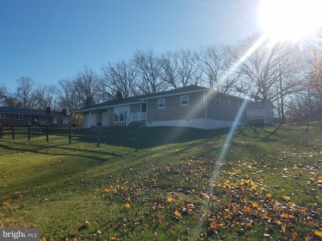 view of front facade featuring a front yard