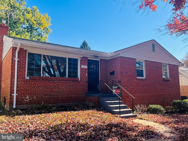 12507 Greenly St, Silver Spring, MD 20906 - view of front of house with brick siding and a chimney