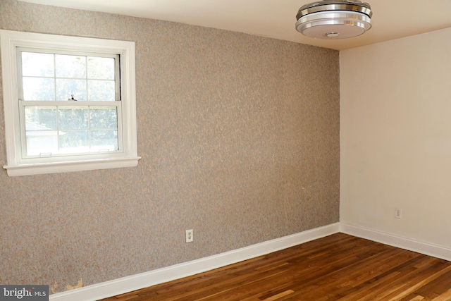 12507 Greenly St, Silver Spring, MD 20906 - empty room with dark wood finished floors and baseboards