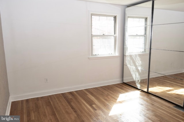 12507 Greenly St, Silver Spring, MD 20906 - unfurnished bedroom featuring wood finished floors and baseboards