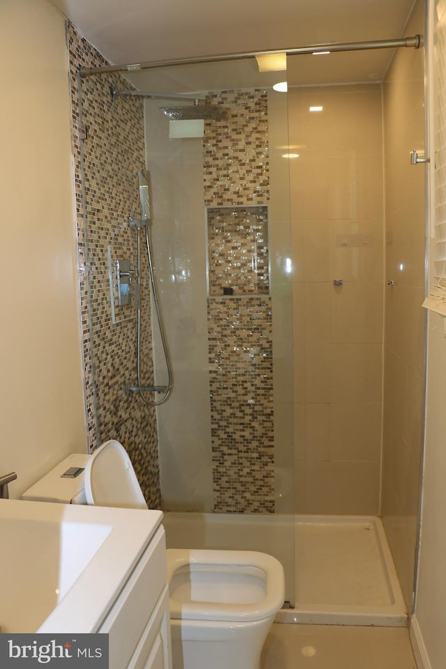 12507 Greenly St, Silver Spring, MD 20906 - bathroom featuring tiled shower, toilet, and vanity