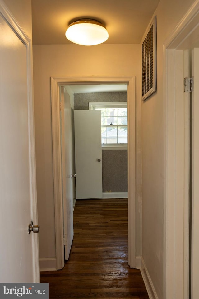 12507 Greenly St, Silver Spring, MD 20906 - hallway with dark wood-style floors and baseboards