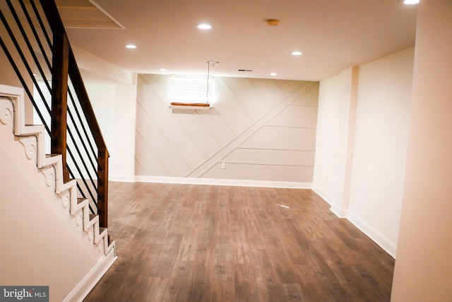 12507 Greenly St, Silver Spring, MD 20906 - finished basement with wood finished floors, stairs, baseboards, and recessed lighting