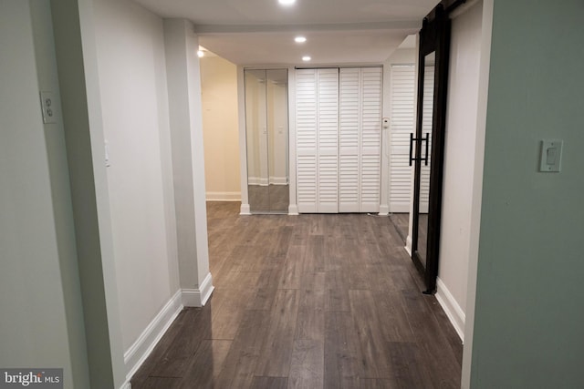 12507 Greenly St, Silver Spring, MD 20906 - corridor with dark wood-style flooring, baseboards, recessed lighting, and a barn door