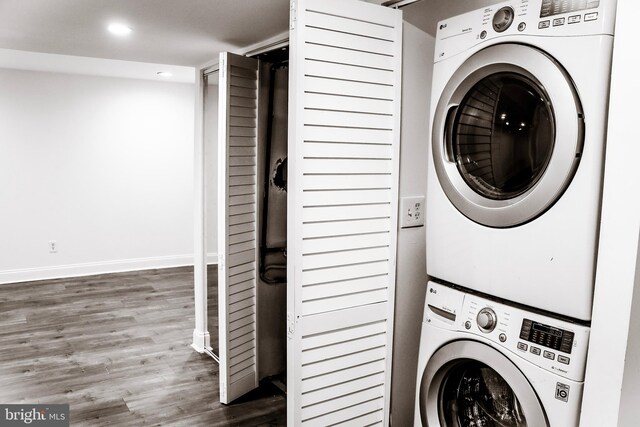 12507 Greenly St, Silver Spring, MD 20906 - laundry room with stacked washer and clothes dryer, wood finished floors, baseboards, and recessed lighting