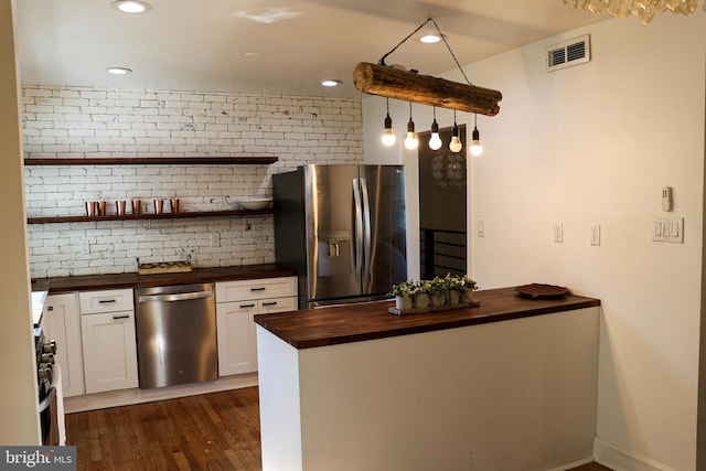 12507 Greenly St, Silver Spring, MD 20906 - kitchen featuring butcher block countertops, appliances with stainless steel finishes, dark wood finished floors, white cabinetry, and open shelves